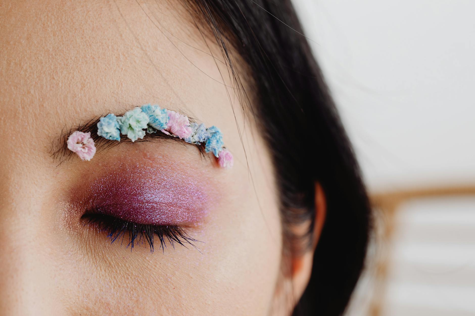 close up photo of a person with glittery eye makeup